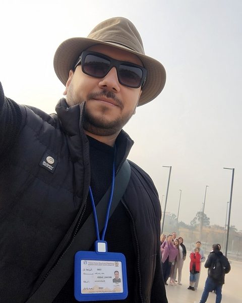 Selfie of Michael Sabry with his tour group on the museum plaza